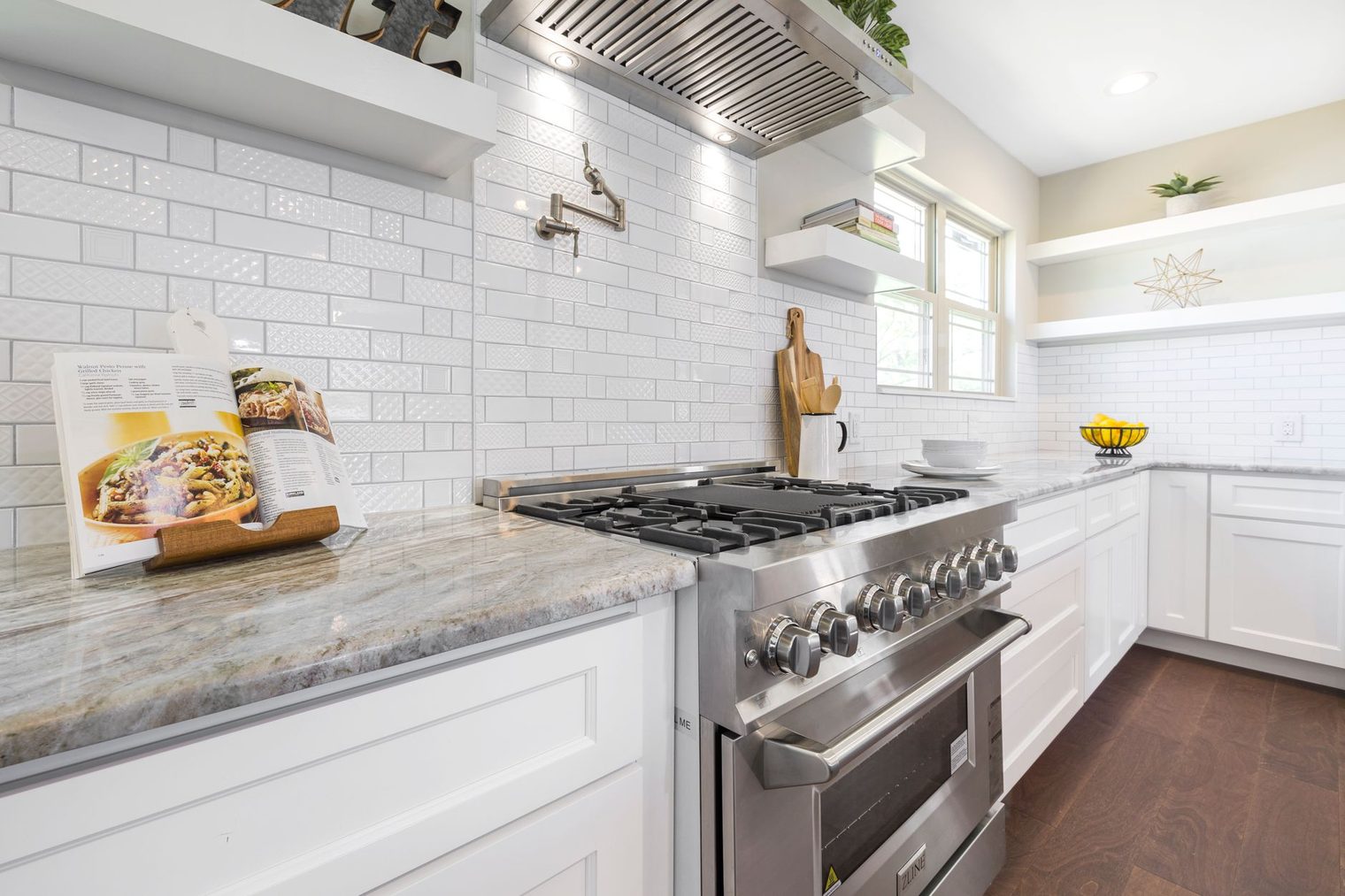 White subway tile backsplash with clean finished edges where the tile meets the counter and turns the corner