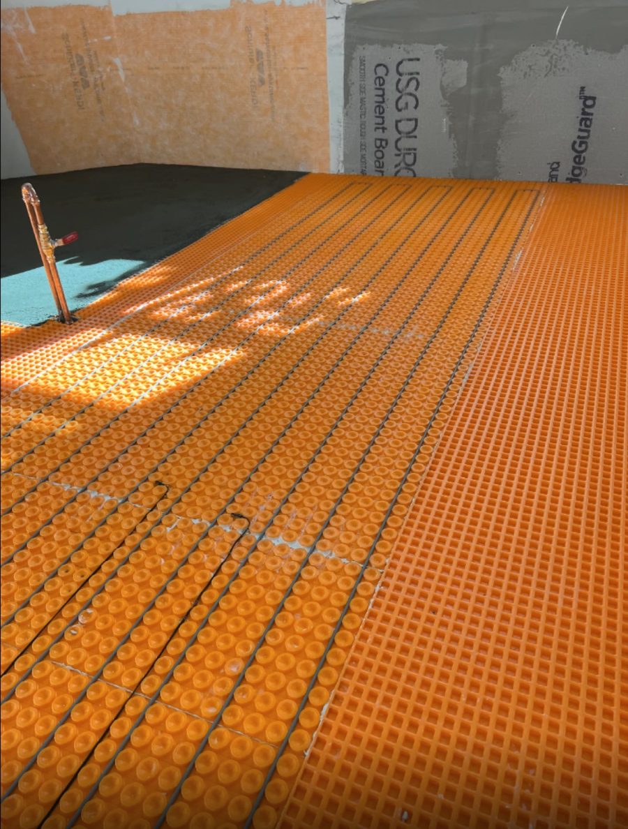Uncoupling membrane laid over the subfloor before floor tile goes down