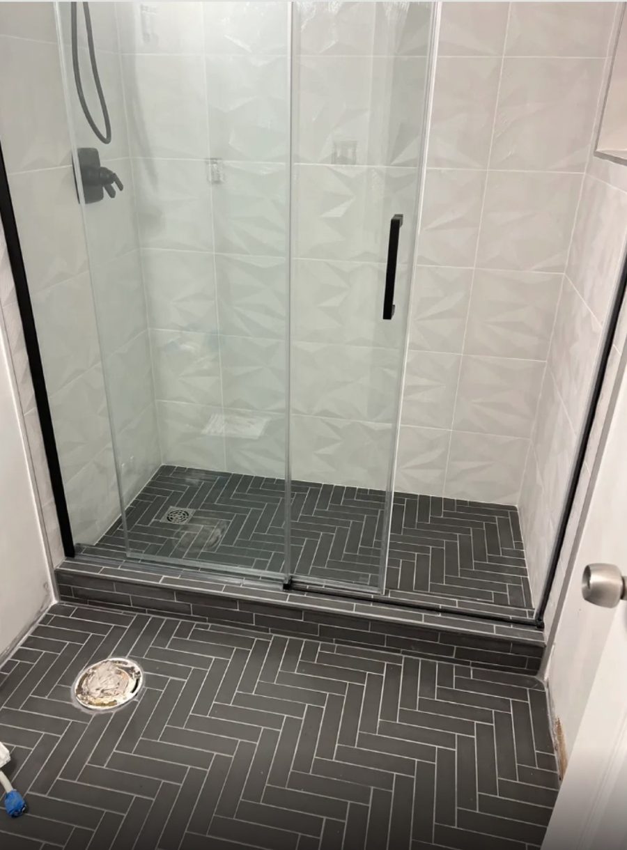 Shower with textured white 3D wall tile that a flat acrylic panel cannot copy