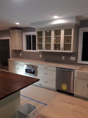 Modern kitchen with grey chevron backsplash tile