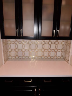Decorative gold and white geometric backsplash tile
