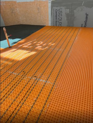 Ditra-Heat radiant floor heating membrane installed before tiling