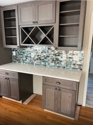 Wet bar backsplash in iridescent blue and cream glass mosaic tile